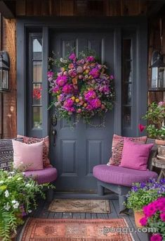 the front door is decorated with pink and purple flowers, while two chairs are on the porch