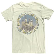 a white t - shirt with an image of a castle and flowers in the middle