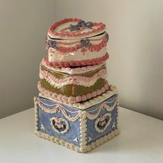 a stack of three cakes sitting on top of each other