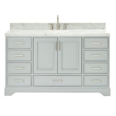 a bathroom vanity with marble top and drawers