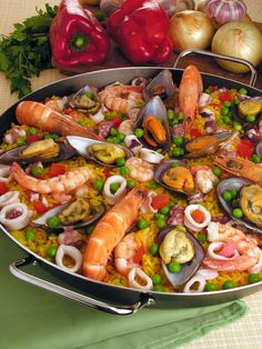 a large platter filled with seafood and vegetables