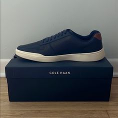 Leather Navy Blue Cole Haan Tennis Sneakers, Never Worn, Eva Bottom And Perforated Leather Upper Navy Casual Sneakers With Plain Toe, Navy Casual Sneakers, Blue Casual Sneakers, Classic Blue Plain Toe Sneakers, Classic Blue Sneakers With Removable Insole, Casual Navy Sneakers With Ortholite Insole, Blue Sneakers With Removable Insole And Plain Toe, Navy Casual Synthetic Sneakers, Cole Haan Sneakers