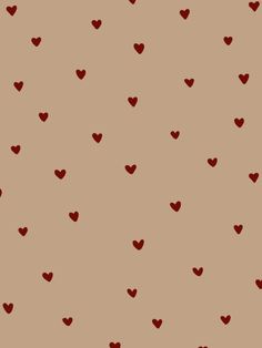 a brown background with red hearts on it