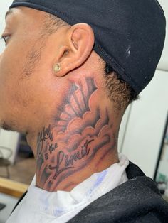 a man with a tattoo on his neck