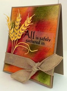 a card with an all is safely gathered message on it and a bow at the bottom