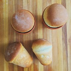 three rolls sitting on top of a wooden table