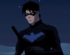 batman animated character standing in the dark with his bat on his shoulder and looking at the camera