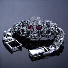 Weighing almost 163 grams, our silver skull bracelet is a heavy jewel you can count on to stand out and stand the test of time! Real men have to wear heavy and high-quality jewelry, if you are one of them then this heavy sterling silver mens bracelet is made for you. As you can see it is mainly painted in silver to make it imposant around your cuff, the second color is black here to highlight the need and beautiful details all around this masterpiece. You can see that on the front of this Jewel Silver Mens Bracelet, Shiny Eyes, Skeleton Head, Mens Bracelet Silver, Skull Bracelet, Real Men, Sterling Silver Mens, Skull Design, High Quality Jewelry