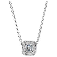 Brilliant 18k White Gold Natural Diamond Halo Necklace w/0.91 ct - GIA Certified Embrace timeless elegance with this brilliant diamond halo pendant necklace, meticulously crafted in stunning 18k white gold. At the heart of the ring lies a brilliant square-cut diamond with 0.80 carat and encircling the magnificent center stone are 16 sparkling diamonds with a total of 0.11 carat weight. GIA Certified for authenticity and excellent quality. Metal: 18k White Gold Main stone: 1 pc Diamond Main stone carat weight: 0.80 ct Shape: Square Color grade: D Clarity grade: VVS1 Side stone: 16 pcs Diamonds Side stone carat weight: 0.11 ct Shape: Round Color grade: E-F Clarity grade: VS Total carat weight: 0.91 ct Total jewelry weight: 2.83 g Certificate Number: GIA 6472769054 Size: Chain Length: 42 cm S Halo Necklace, Halo Pendant, Diamond Halo, Brilliant Diamond, Sparkle Diamonds, Halo Diamond, Natural Diamonds, Timeless Elegance, Jewelry Necklace Pendant