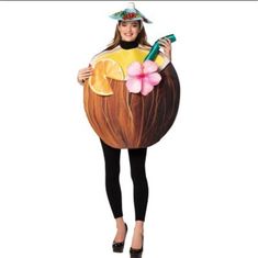 a woman in a costume that is holding an orange slice and a bottle with a flower on it