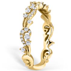 a yellow gold ring with diamonds on it