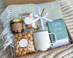 a gift box filled with treats and coffee