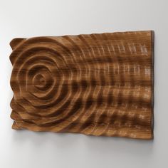 a piece of wood that has been carved into the shape of a spiral on it