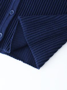 Introducing our Ribbed Knit Cardigan-Navy. With a classic ribbed knit design, this cardigan offers both comfort and style. Elevate your look with our Ribbed Knit Cardigan. Blue Ribbed Knit Outerwear, Classic Ribbed Cardigan For Layering, Ribbed Knit Button-up Outerwear, Ribbed Knit Button-up Cardigan, Navy Cardigan With Ribbed Cuffs For Fall, Navy Long Sleeve Ribbed Sweater, Fitted Navy Casual Cardigan, Navy Ribbed Sweater For Winter, Fitted Ribbed Blue Cardigan