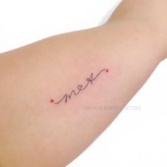 a woman's arm with the word love written in cursive writing