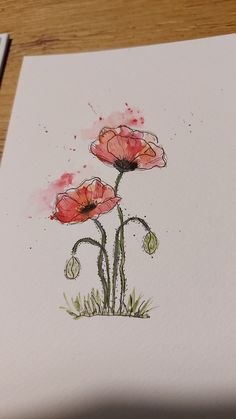 watercolor painting of three red flowers on white paper with green stems in the foreground