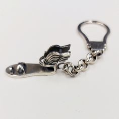 Hermes winged sandal keychain in sterling silver 925/Handmade pendant/ Mythology/Museum jewelry/Ancient Greek/Art Luxury. The handmade silver sandal includes Hermes sandals as a central motif.  Hermes is an Olympian deity in ancient Greek religion and mythology. Hermes is considered the herald of the gods. He is also considered the protector of human heralds, travelers, thieves, merchants, and orators. He is able to move quickly and freely between the worlds of the mortal and the divine, aided b Museum Jewelry, Hermes Sandals, Silver Sandal, Ancient Greek Art, Silver Keychain, Greek Jewelry, Jewelry Workshop, Family Jewellery, The Orator