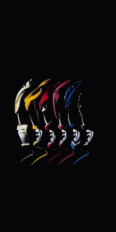 a group of different colored vases sitting next to each other on a black background