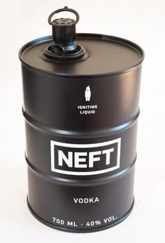 a black canister sitting on top of a white table