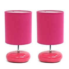 two bright pink lamps are next to each other