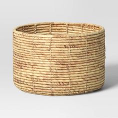 a large woven basket on a white background