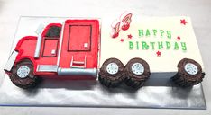 a birthday cake shaped like a tractor trailer