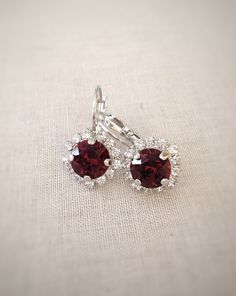 Gorgeous earrings featuring 8mm round Burgundy crystals in a halo of tiny sparkling clear crystals. Shown in the drop style. Also available in studs. Please select earring style and metal finish from the drop down menu at checkout. Burgundy Earrings, Burgundy Bridesmaid, Earrings Bridesmaid, Earrings Crystal, Earrings Red, Swarovski Crystal Earrings, Wedding Jewelry Earrings, Silver Stud Earrings, Swarovski Earrings