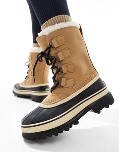 Shoes by Sorel Winter wardrobe staple Pull tab for easy entry Lace-up fastening Signature Sorel branding Round toe Chunky sole Lugged tread Sorel Caribou, Trainer Heels, Sorel Winter, Marken Logo, Leggings Sale, White Trainers, Maxi Dress Trend, Heeled Loafers, Sportswear Women