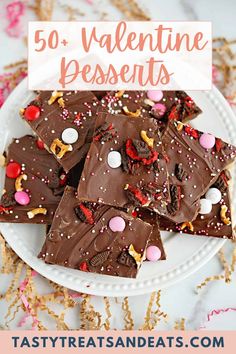 valentine's day desserts on a white plate with pink and gold sprinkles