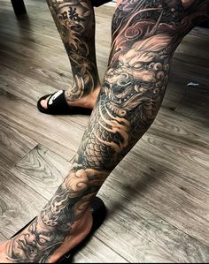 a person with tattoos on their legs and feet