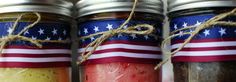 three jars filled with different colored food and one has an american flag painted on it