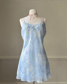 - Soft slip dress in muted blue featuring embossed flower pattern with ruched bustier detail- bow adorned; adjustable straps; double layered dress- size M- excellent condition with no flaws 🤍 Size of mannequin: size 2 - 4 Blue Slip Dress With Tie Back And Spaghetti Straps, Blue Dresses With Bow Straps, Layered Dress, Muted Blue, Pretty Clothes, Bustiers, Dress Clothes For Women, Flower Pattern, Hot Summer