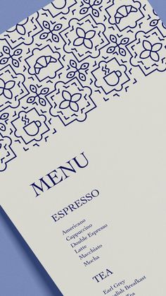 a menu designed to look like an intricate pattern with the word menu printed on it