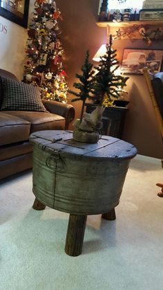 a living room filled with furniture and christmas trees