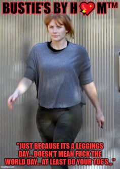 a woman with red hair is walking in front of a metal wall wearing leggings