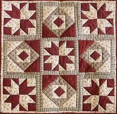 a red and white quilted wall hanging