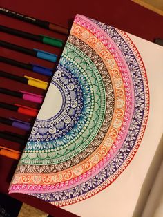 an art project with colored pencils and markers