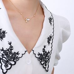 Style: Female Material: Titanium Steel, Mother of Pearl/Seashell Pearl Type: Cultured Pearl Color: White Necklace Length: 40+5cm Pendant: 1.8*1.35cm Elegant Clavicle Chain Charm Necklaces For Beach, White Shell Necklace With Clavicle Chain, Elegant Shell Necklace With Clavicle Chain As Gift, Elegant Clavicle Chain Shell Necklace As Gift, Elegant Summer Charm Necklaces, White Clavicle Chain Necklace For Summer, Elegant Gold Charm Necklace For Summer, Elegant Summer Charm Necklaces As Gifts, Elegant Summer Charm Necklaces For Gifts