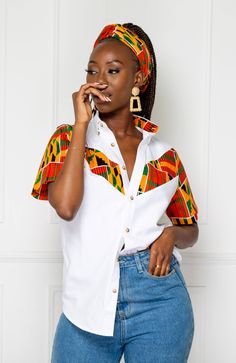 These super jazzy African Print Shirts for Women are made from 100% African wax fabric. It features a vibrant Ankara Floral design and a crisp tailored smart collar. This shirt is best paired with casual contrast shorts, a bucket hat and trainers for a complete colourful festival outfit. Shop the rest of the collection HERE. FEATURES Ankara fabric Button down shirt Short sleeved Ankara is 100% African Wax Cotton The model is 5'6" and wears our blazer in size (M) Medium. HOW TO CARE FOR AFRICAN W Kitenge Tops, African Print Shirts, Ankara Shirt, African Print Shirt, African Tops, African Print Tops, Afrikaanse Mode, African Fashion Ankara, African Shirts