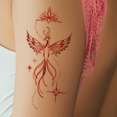 a woman's thigh with a tattoo design on it