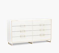 a white dresser with gold handles and drawers