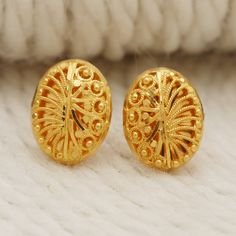 Please click -- Learn more about this item -- below for a full description 22k gold earrings handmade jewelry made in India weight is 4.55 grams approx. length is 1.4 centimeter approx. width is 1.1 centimeter approx. please message me if you want real gold screw/backs. Gold Oval Earrings With Intricate Design, Traditional Oval Yellow Gold Earrings, 22k Yellow Gold Earrings For Gift, Traditional Gold Oval Earrings, 22k Yellow Gold Earrings For Anniversary, Traditional Oval Gold Earrings, Gold Round Earrings For Puja, Yellow Gold Earrings As Diwali Gift, 22k Yellow Gold Temple Jewelry Earrings