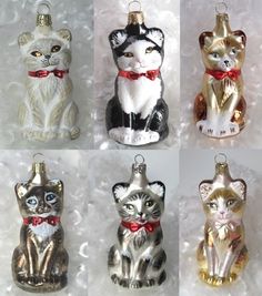 six glass ornaments in different colors and sizes, with cats wearing bow ties on them