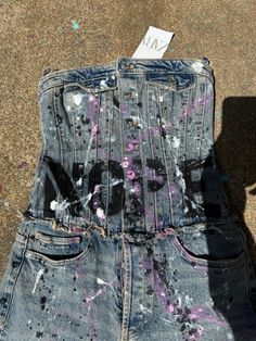 Hand painted Zara Jean Jumpsuit Size small Denim has stretch 13" across the top 15" across the waist 29.5" inseam NOPE Hand wash gentle. Streetwear Graffiti, Senior Jeans Painted 2023 Blue, Paint Splattered Overalls, Spray Paint Clothes, Streetwear Design Inspiration, Jeans With Graffiti, Paint Splatter Cotton Jeans For Streetwear, Graffiti On Denim, Trendy Graffiti Print Denim Jacket