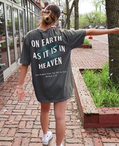 On Earth As It Is In Heaven Christian T-Shirt | Comfort Colors ® Shirts | Religious Christian Apparel | Faith Based Christian Merch  This Would Make a great baptism gift or bible study shirt for her !  💕MADE WITH DTG * P R I N T I N G  Designs are printed directly on the garment using DTG (direct to garment) to ensure a long-lasting, vibrant & durable finish. The process itself resembles digital printing on paper. Using this technique, pigmented water-based inks are applied to the garment's sur Heaven Tshirt, Make Heaven Crowded Shirt, Graphic Tee Christian, Christian Tee Shirts Elevated Faith, Faith Based Shirt, Display Design, Faith Based, Christian Clothing, Dye T Shirt