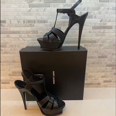 Saint Laurent 105 Mm Tribute Platform Sandals Size 39 Color Black High Heel Stiletto Sandals With Intertwining Straps Made With Metal-Free Tanned Leather, Featuring A Beveled Platform, Covered Heel And Adjustable Ankle Strap Engraved With Saint Laurent Paris. Two Heel Heights Available. 100% Calfskin Leather Chrome Free And Metal Free Tanned Leather Total Heel Height: 13,5 Cm / 5.3 Inches Arch Height: 10,5 Cm / 4.1 Inches Platform Height: 3 Cm / 1.2 Inches Leather Sole Adjustable Ankle Strap Sty High Heel Platform Sandals For Cocktail, Designer Formal Sandals With 4-inch Heel, High Heel Platform Sandals For Cocktail Occasions, Designer Closed Toe Heels With Heel Strap, Luxury Black Sandals With Ankle Strap, Designer Black Sandals With Wrapped Heel, Designer Evening Sandals With 4-inch Heel, Luxury Sandals With Heel Strap For Night Out, Luxury Heels With Heel Strap And Closed Toe