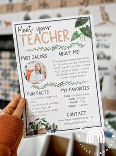 a person holding up a poster with the words meet your teacher