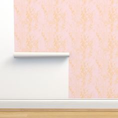 an empty room with pink wallpaper and a white roller on the wall next to it