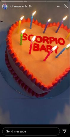 a heart shaped cake with candles on it that says scorppo barz