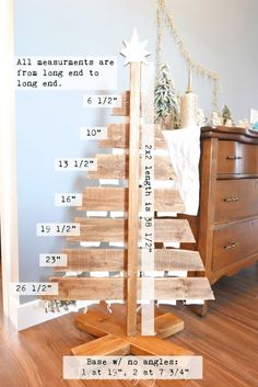 a wooden christmas tree with measurements on it